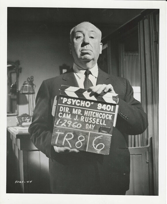 ALFRED HITCHCOCK WITH CLAPPER BOARD FOR PSYCHO (1960)