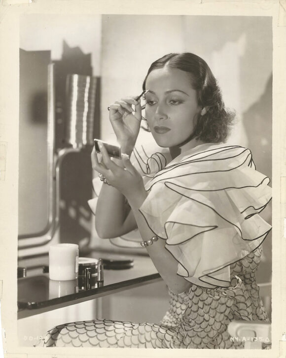 DOLORES DEL RÍO IN MAKE-UP AT WARNER BROTHERS (ca. 1935) Studio portrait