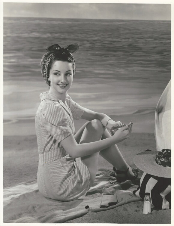 VIRGINIA O'BRIEN DEMONSTRATES PROPER SUNBATHING TECHNIQUES (1943) Oversized photo by Clarence Bull