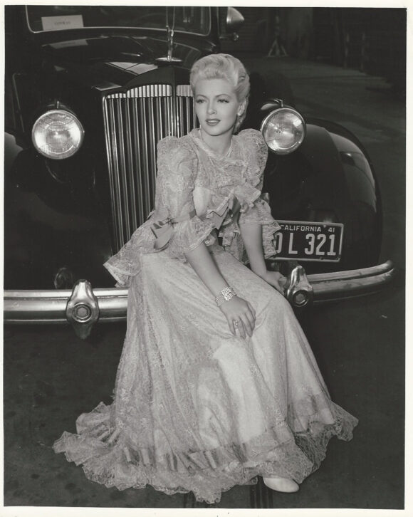 LANA TURNER RESTS ON A CAR BUMPER (1941) BTS photo